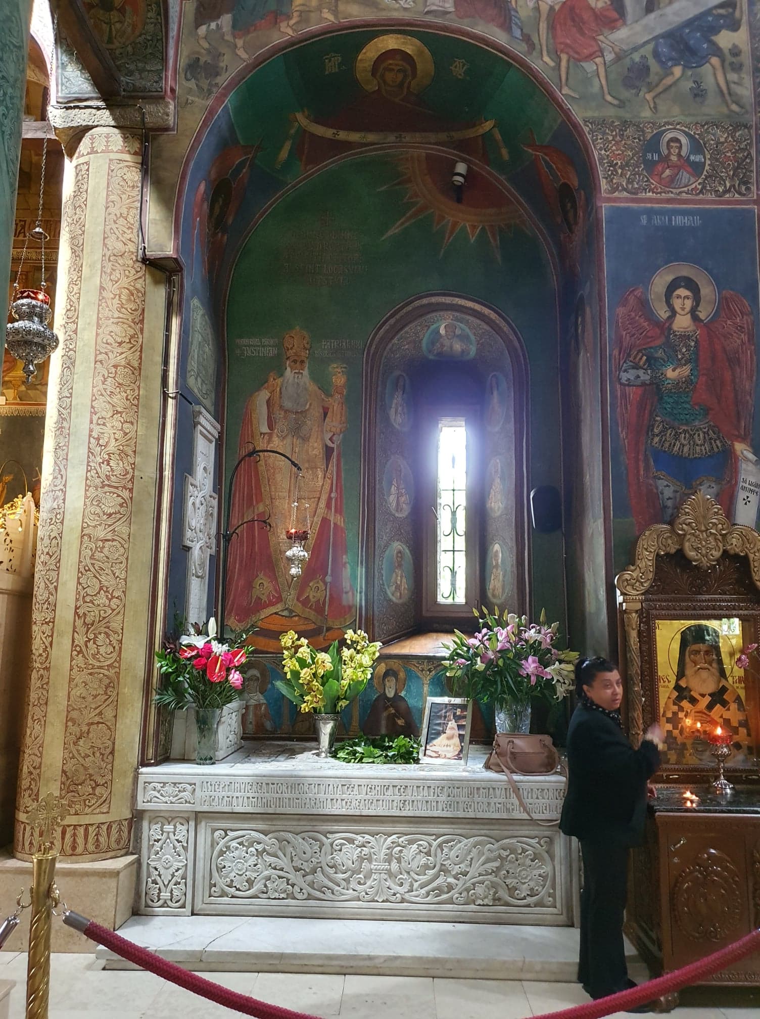 The left arched niche with the tomb of Romanian Patriarch Justinian Marina