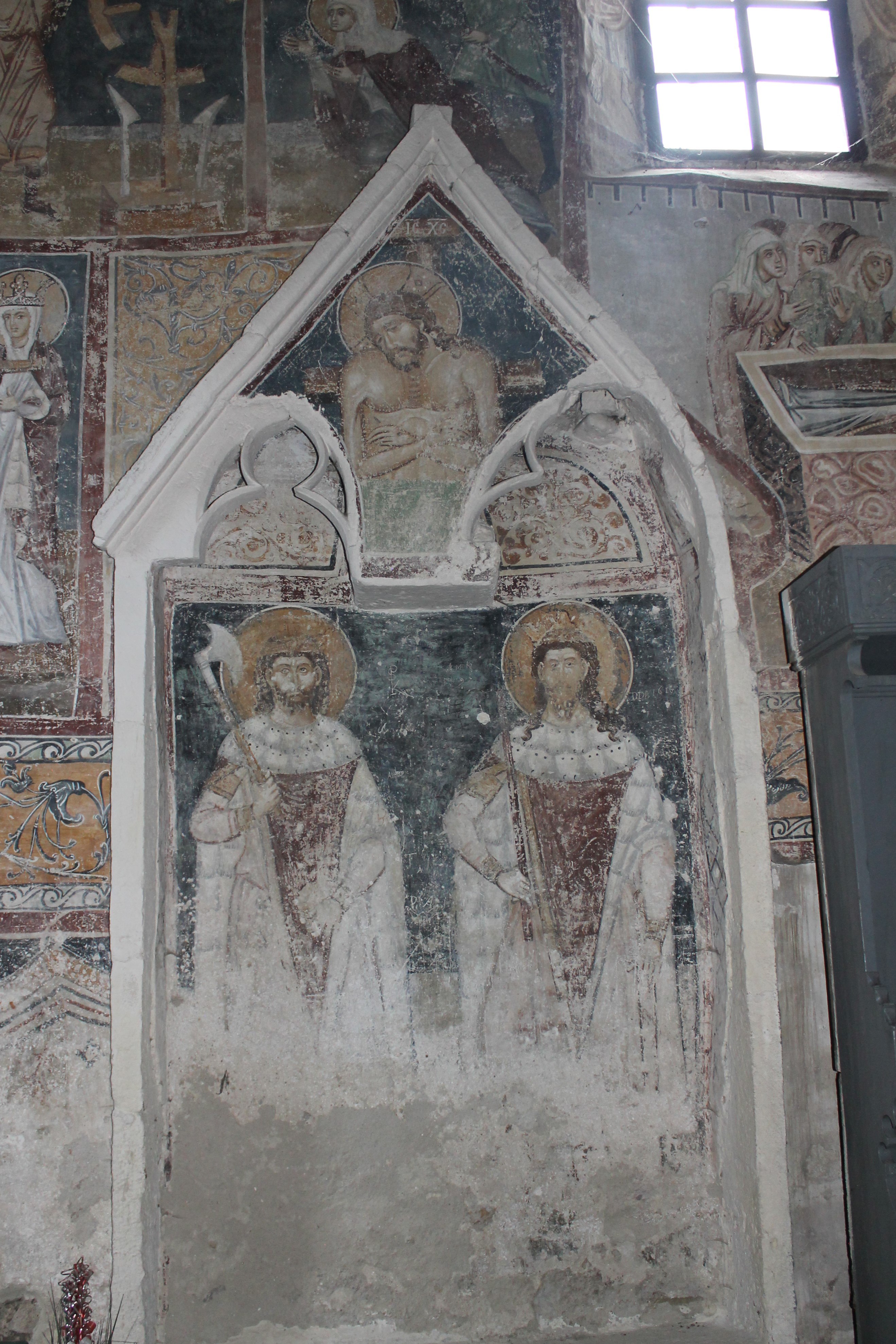 The iconography of the southern wall: Vir Dolorum, Sts. Stephen and Ladislas, Sts. Constantine and Helena flanking the True Cross, and the cycle of St. Catherine of Alexandria, Dârlos Romania, 15th century (source: M. D. Anghel)